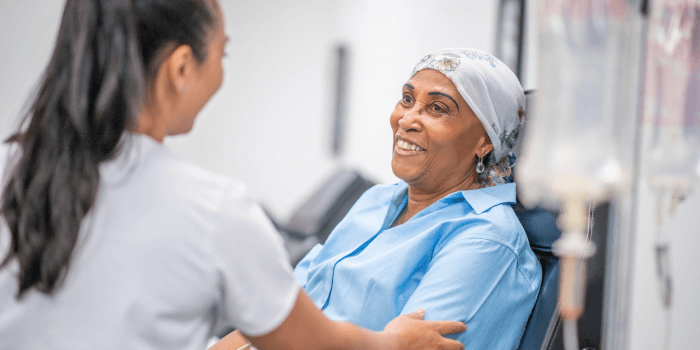 Oncology nurse with patient going through treatment